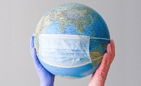 Globe with mask image by Anna Shvets via Pexels.com Globe with mask image by Anna Shvets via Pexels.com